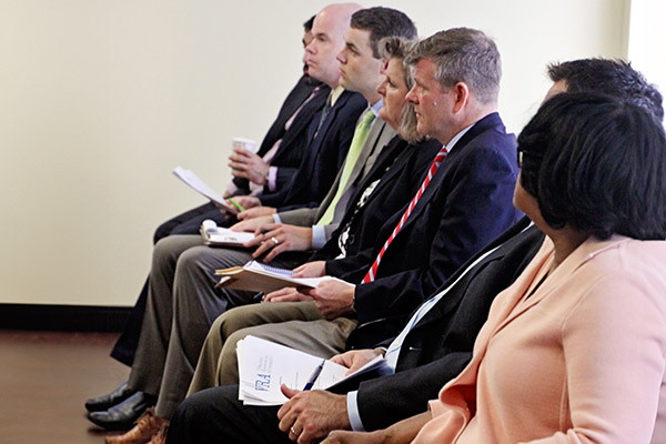 VRA staff sit during meeting.